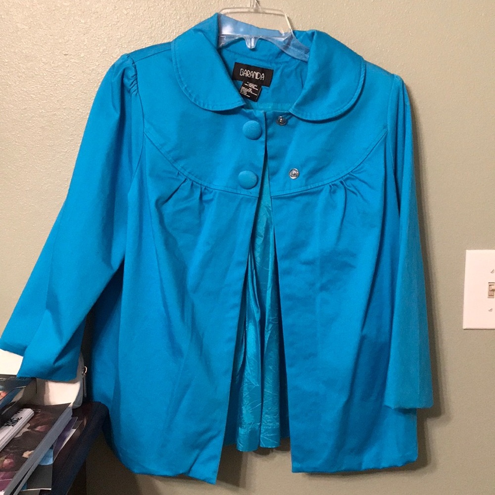 Blue Jacket with 2 snap buttons and pleated back.